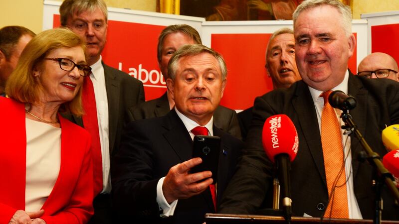 Brendan Howlin  of the Labour Party reading a text message from Alan Kelly after his election as leader of the Labour party. Photograph: Cyril Byrne