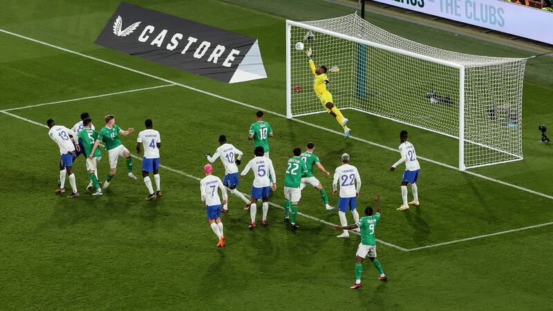 France's Mike Maignan makes a save from a head from Nathan Collins of Ireland. Photograph: Ben Brady/Inpho