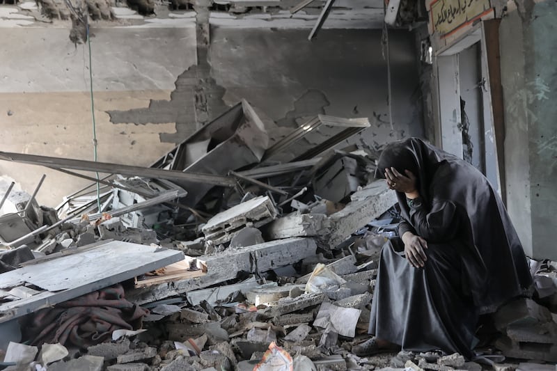 A Palestinian woman sits among the rubble of Yaffa School in the Tuffah neighbourhood of Gaza City following overnight Israeli strikes, on Monday, June 30th, 2025. Photograph: Omar al-Qattaa/AFP/Getty