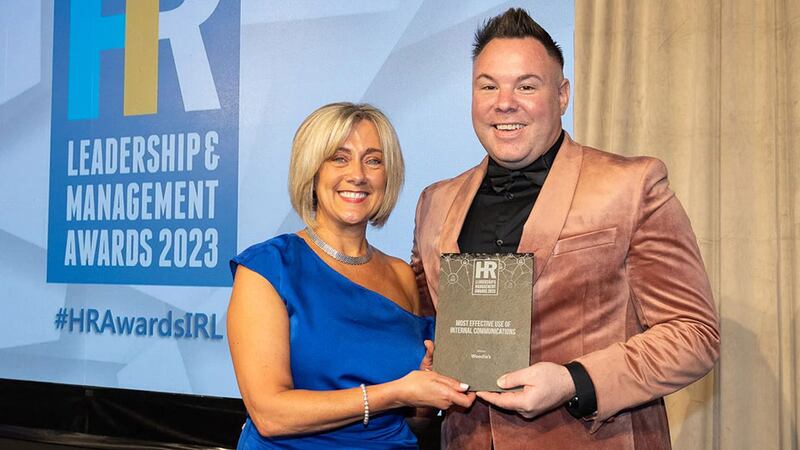 Lorraine Crawford, awards judge, presents the most effective use of internal communications award to David Nally, Woodie’s