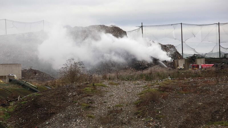Fire fighters from Kildare Fire Station are seen trying to control an underground fire at the landfill site at Kerdiffstown in 2011.   Photograph: Brenda Fitzsimons/The  Irish Times