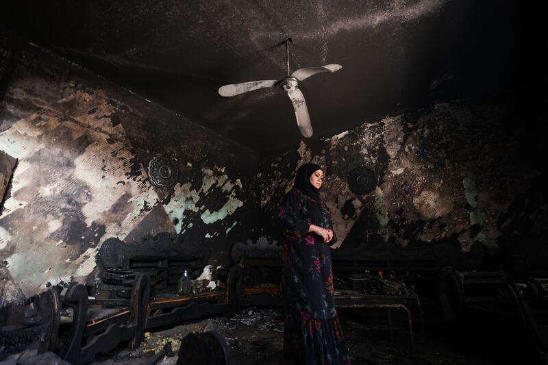 A Palestinian woman inspects the damage inside her home at the Jenin refugee camp. Photograph: Alaa Badarneh/EPA