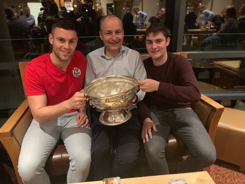 Micheál Aodh and Cillian with their father
