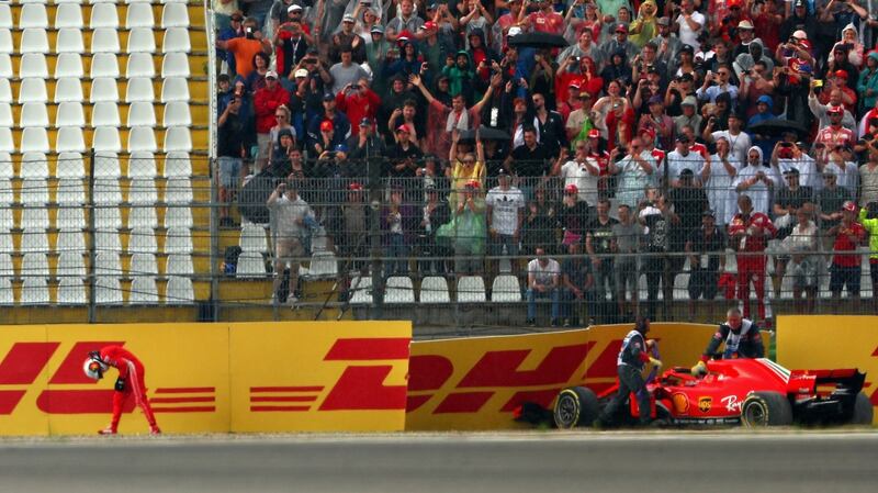 Sebastian Vettel walks away from his Mercedes after crashing suring the German Grand Prix at  Hockenheim. Photograph: Dan Istitene/Getty Images