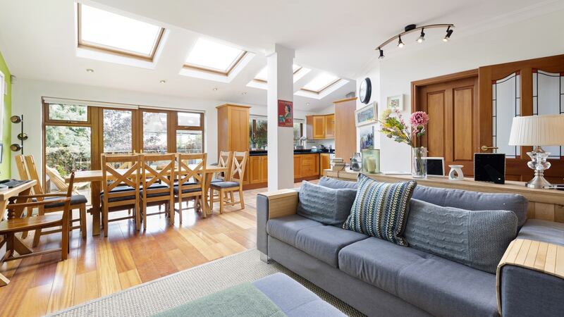 Family/dining room and kitchen with French doors to deck