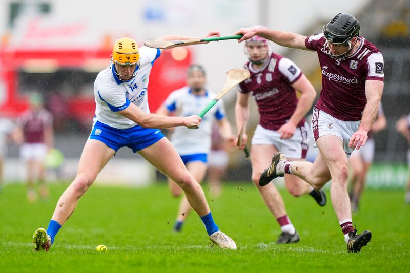 Galway's Cillian Trayers and Waterford's Sean Walsh compete for possession. James Lawlor/Inpho
