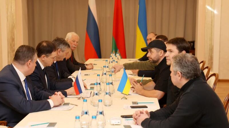 The Russian delegation (L), including Russian presidential aide Vladimir Medinsky (2nd from L), and Ukrainian delegation (R) attending Russia-Ukraine negotiations in the Gomel region in Belarus on Monday. Photograph: EPA/Sergei Kholodilin/BelTA/Handout