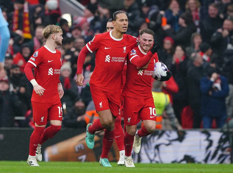Liverpool's Alexis Mac Allister (right) celebrates with team-mates after scoring their first goal of the game. Photograph: Peter Byrne/PA