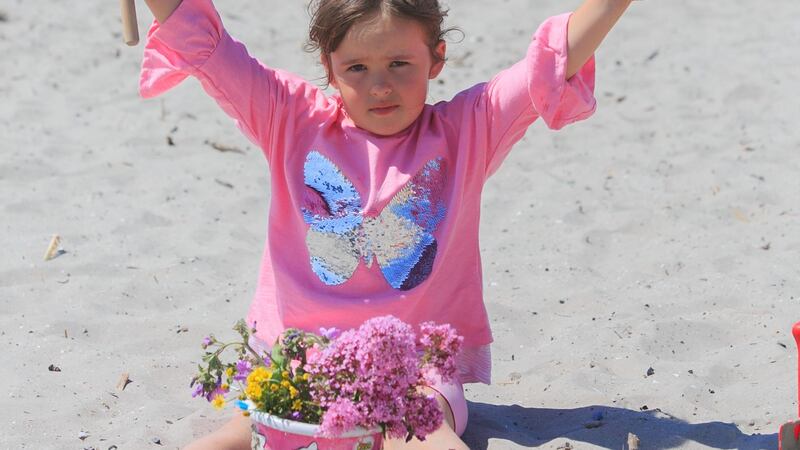 Lucia Pivarci (6) from Clontarf enjoying the good weather on Bull Island, Dublin. Photograph:  Gareth Chaney/Collins