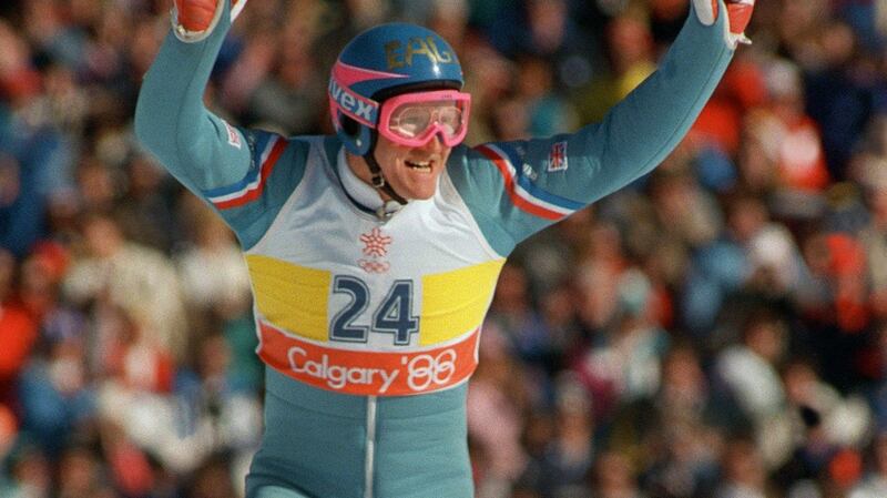 Britain’s first ever Olympic ski jumper Eddie Edwards waves   after completing his first safe jump during the 90m event    at the   Winter Olympic Games. Photograph: Getty Images