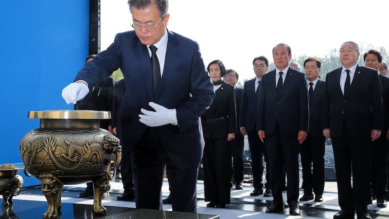 South Korean president Moon Jae-in burns incense at a national cemetery in northern Seoul, South Korea, on Thursday to mark the anniversary of the 19 April Revolution, a popular pro-democracy and anti-dictatorship uprising in 1960. Photograph:  EPA/Yonhap