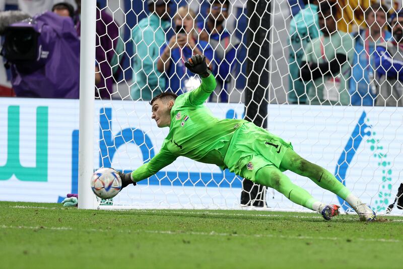 Dominik Livakovic of Croatia saves the second penalty from Kaoru Mitoma of Japan. Photograph: Richard Heathcote/Getty