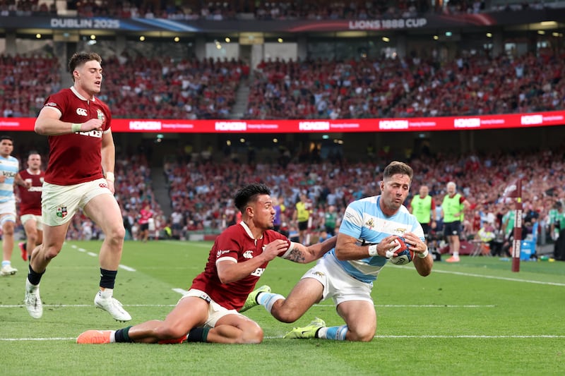 Santiago Cordero of Argentina scores the teams third try under pressure from Marcus Smith of British & Irish Lions during the 1888 Cup international match between British & Irish Lions and Argentina. Photograph: David Rogers/Getty Images