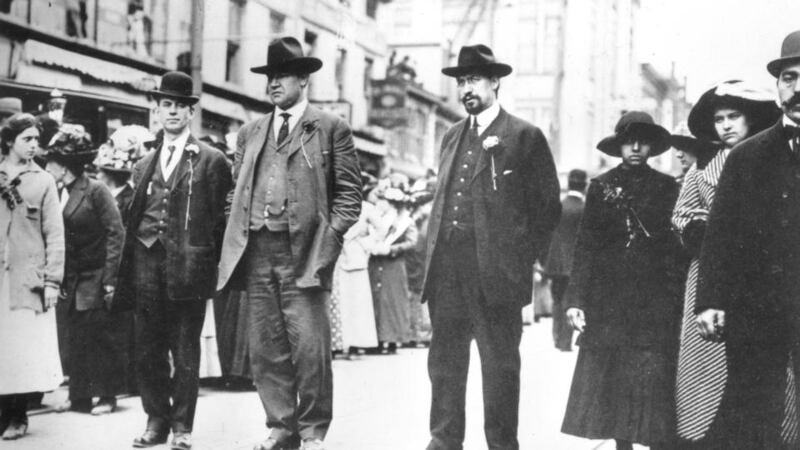 James Connolly was a founding member of the syndicalist Industrial Workers of the World (IWW or ‘Wobblies’) in America in 1905 – its leaders  William (Big Bill) Haywood (centre),   flanked by Adolph Lessing  and Carlo Tresca   are pictured  as they  lead a silk workers’ demonstration during the 1913 strike in  Paterson, New Jersey. Haywood was among international personalities who came in person to support Dublin.  (Photo by PhotoQuest/Getty Images)