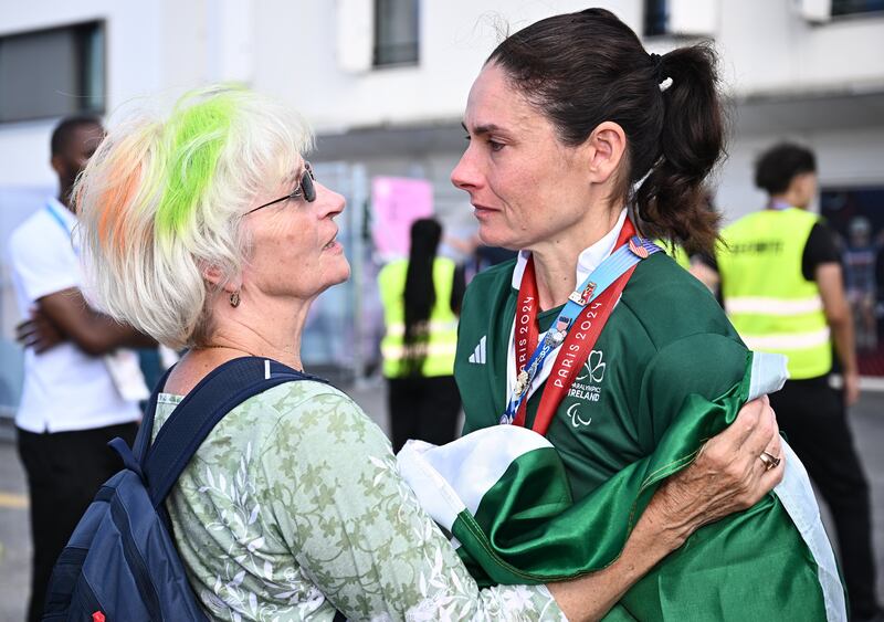 Ireland's Katie-George Dunlevy celebrates with her mother, Alana, after winning silver in the women's B 3000m individual pursuit final in Paris. Photograph: Harry Murphy/Sportsfile 