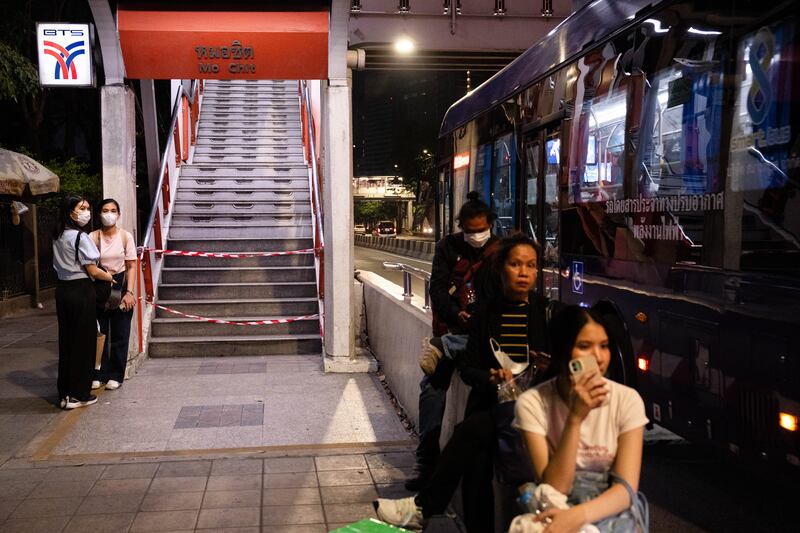 People wait at a bus station in Bangkok after the earthquake. Photograph: Chanakarn Laosarakham/Getty      
