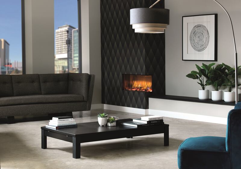 The Dimplex range, including the Vivente 750 with a corner glass window shown, can be installed in apartments and other spaces that don’t have a flue