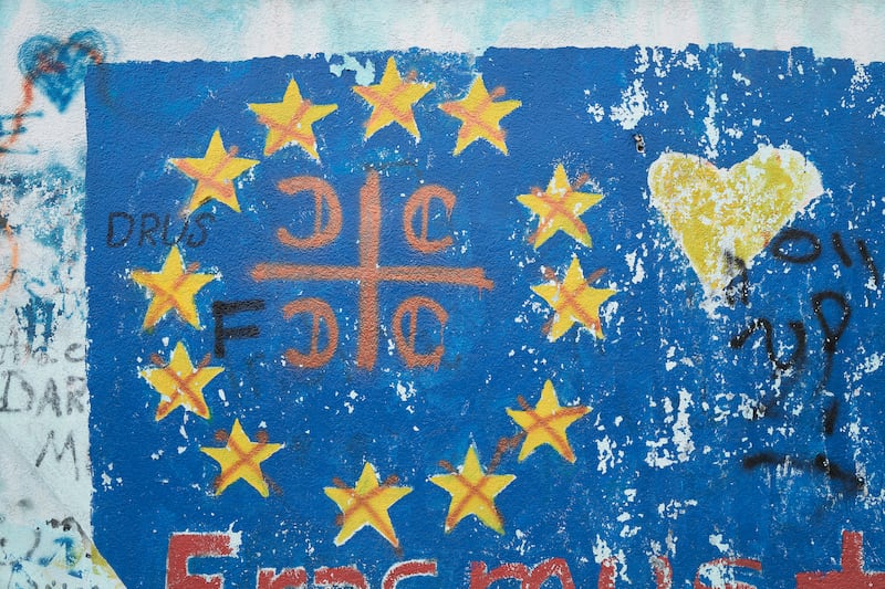 A cross with the sign of the Serbian Orthodox Church on a flag of the European Union in Berane, Montenegro. Photograph: Pierre Crom/Getty Images