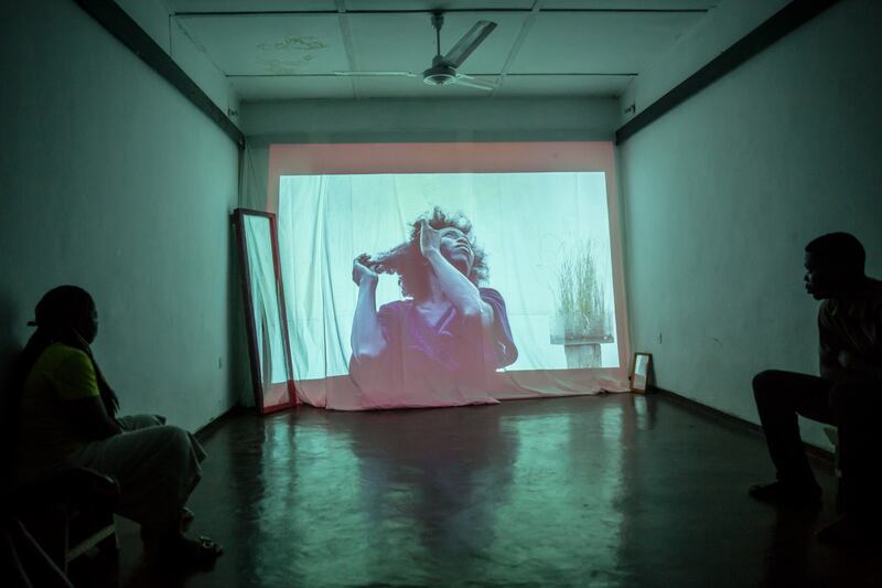 A film showing Va-Bene Elikem Fiatsi after her hair is unbraided is played at her artists' residency. Photograph: Sally Hayden