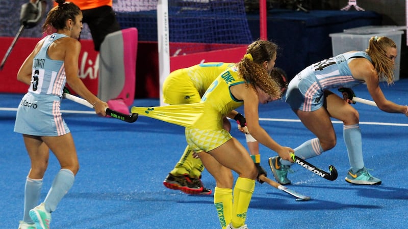 Argentina’s Bianca Donati hooks the shirt of Australia’s Ambrosia Malone. Photogrpah: Sean Dempsey/EPA