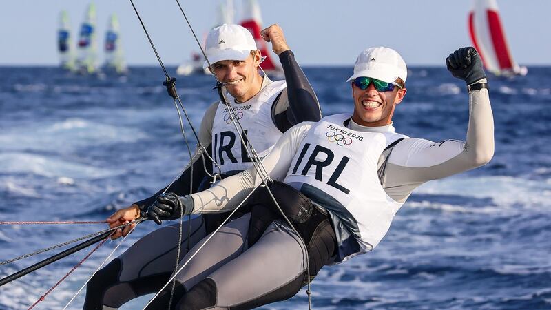 Ireland’s Robert Dickson and Seán Waddilove celebrate winning their final race at the 2020 Tokyo Olympic Games, in Enoshima Yacht Harbour, Fujisawa, Japan. Photograph: David Branigan/Oceansport/Inpho