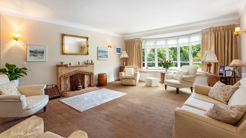 Living room with bay window to back garden.