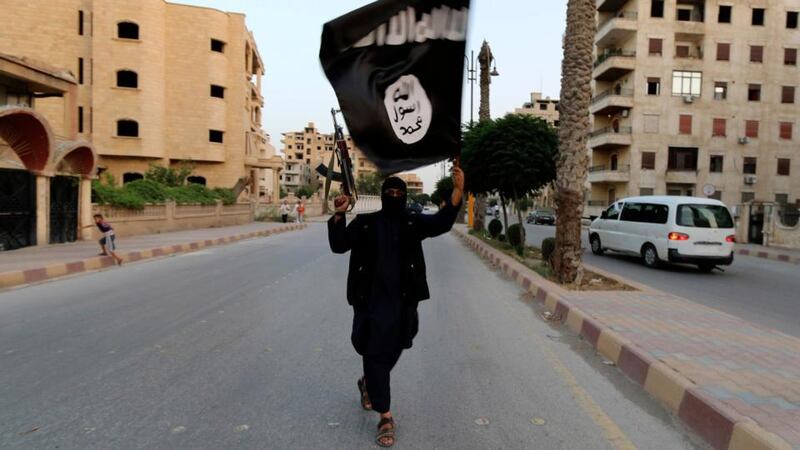 An Isis militant in Raqqa. Photograph: Reuters/Stringer