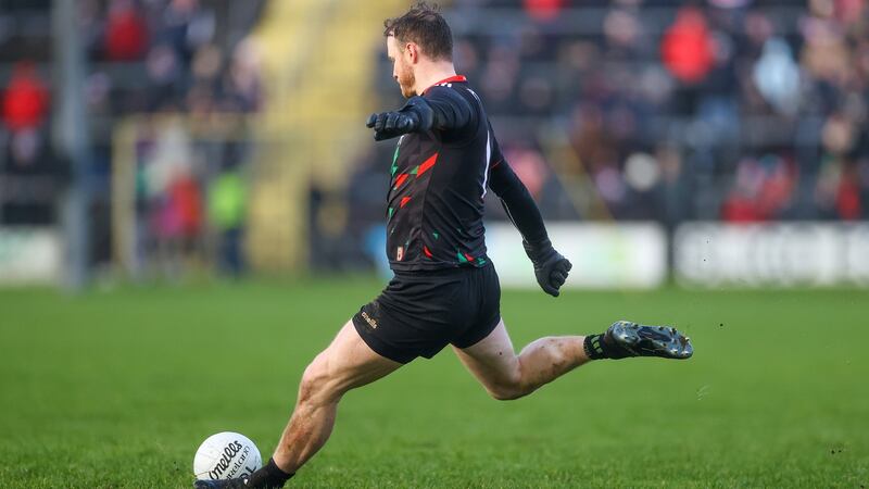 Mayo’s Rob Hennelly kicks a point to earn his side a late draw with Donegal. Photograph:  James Crombie/Inpho
