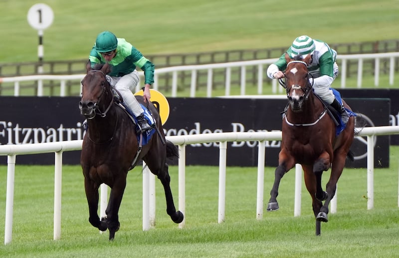Shackleton ridden by Ryan Moore (left) on their way to winning the Trainor Stone And Tile Irish EBF Maiden at Curragh racecourse, Dublin. Photograph: Niall Carson/PA 

