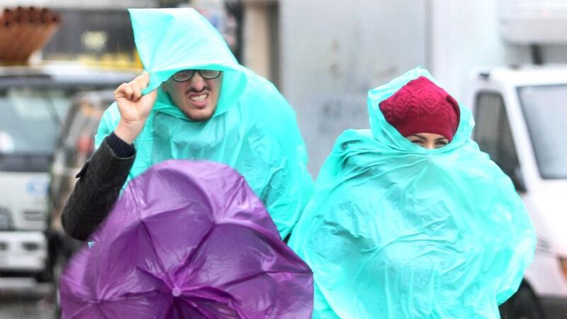People walking in Dublin yesterday morning as heavy rain fell. Photograph: Sam Boal/Photocall Ireland