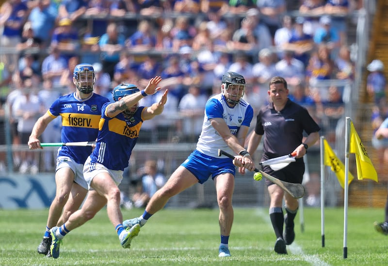 Tipperary's Willie Connors looks to block Darragh Lyons of Waterford during the game in Thurles. Photograph: Bryan Keane/Inpho
