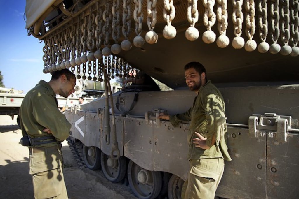 Israeli soldiers at the Kibbutz Be’eri, which was attacked by Hamas. Photograph: Hannah McCarthy
