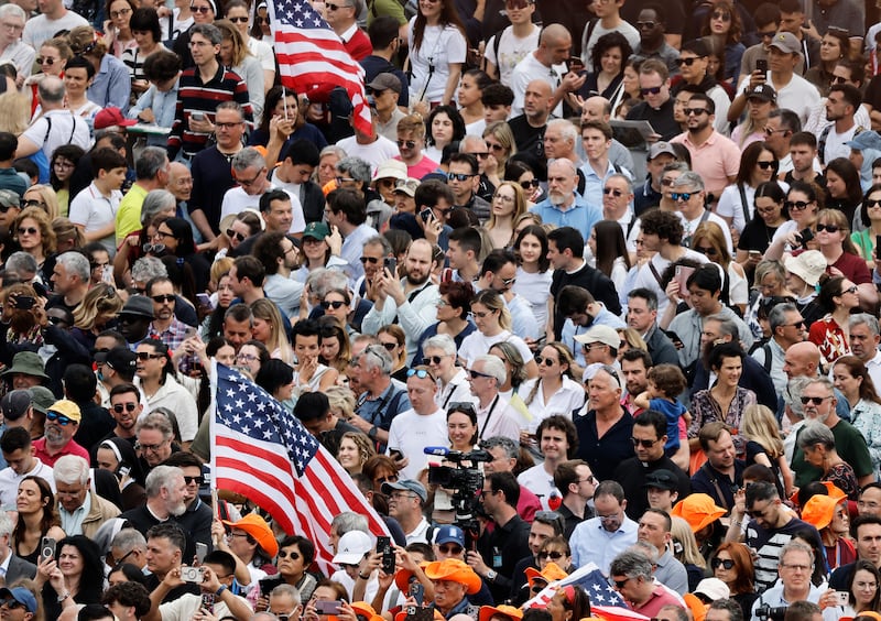 Members of the crowd hold American flags as they gather for the Regina Caeli prayer in St Peter's Square on Sunday in Vatican City. Photograph: Mario Tama/Getty Images