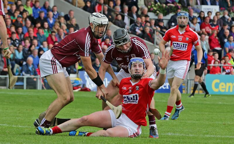 Patrick Horgan gets off a pass despite Galway's Aidan Harte and Daithi Burke during teh 2-15 All-Ireland quarter-final. Photograph: Morgan Treacy/Inpho