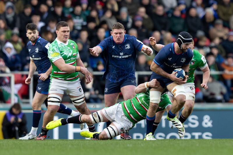 Caelan Doris of Leinster is tackled by Harry Wells of Leicester. Photograph: Juan Gasparini/Inpho
