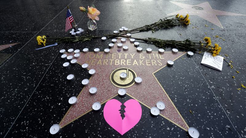 Tom Petty’s star on the Hollywood Walk of Fame is adorned with flowers, candles and cards in Hollywood. Photograph: Mike Nelson/EPA