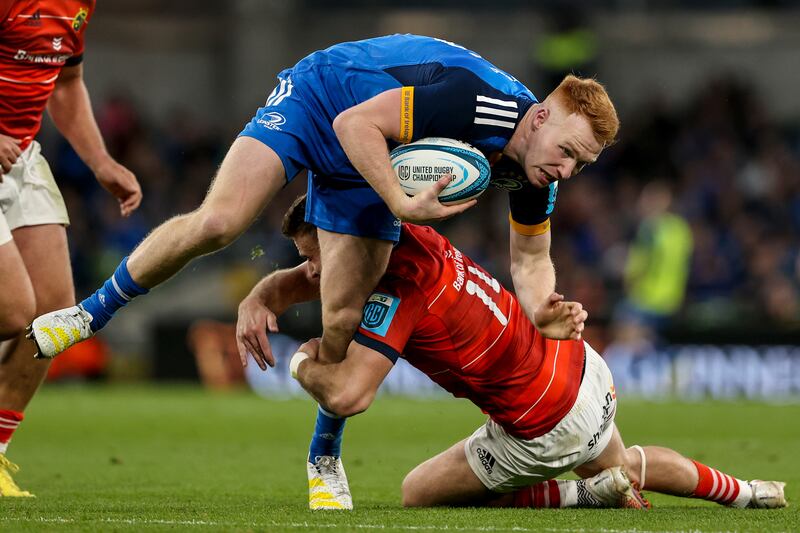 Leinster's Ciarán Frawley is tackled by Shane Daly of Munster during the 
BKT United Rugby Championship match at the Aviva Stadium. Photograph: Ben Brady/Inpho