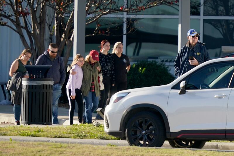 People leave Dallas Executive Airport following the incident (LM Otero/AP)