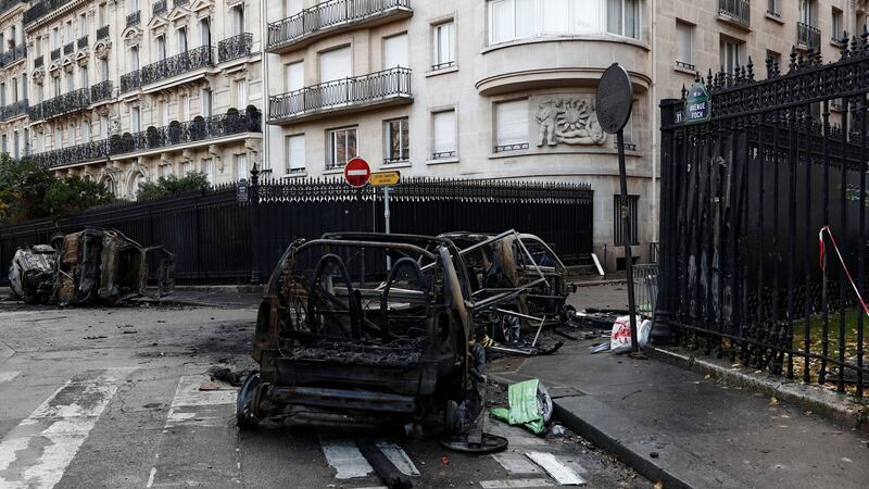 Destroyed cars  on the morning after clashes with protesters against fuel tax rises,  in Paris, France. Photograph: Benoit Tessier/Reuters
