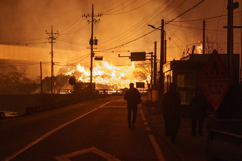 A wildfire sweeps through Andong City, South Korea, on March 26th. Photograph: Chang W Lee/The New York Times
                      
