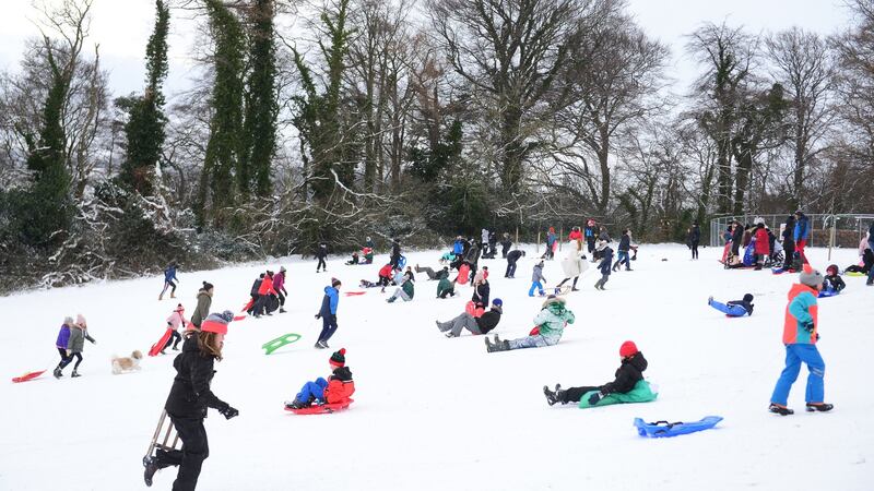 Hundreds of people took to the ’slopes’ in Bushy Park, Terenure, Dublin on sleighs, sledges and dustbin lids to slide on the snow. Photograph: Bryan O’Brien