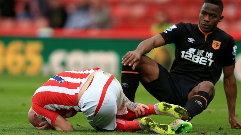 Stoke City’s Stephen Ireland lies injured after a after a tackle from Maynor Figueroa
