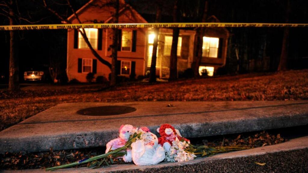 A makeshift memorial is shown outside a home in a suburban neighborhood in Douglasville, Georgia. At least seven people were shot in the community west of Atlanta on Saturday in an attack that left five people dead, local media reports. Photograph: John Amis/Reuters