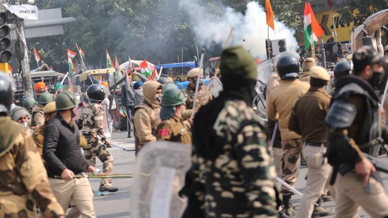 Police use tear gas against farmers in Delhi on Tuesday. Photograph: Harish Tyagi/EPA