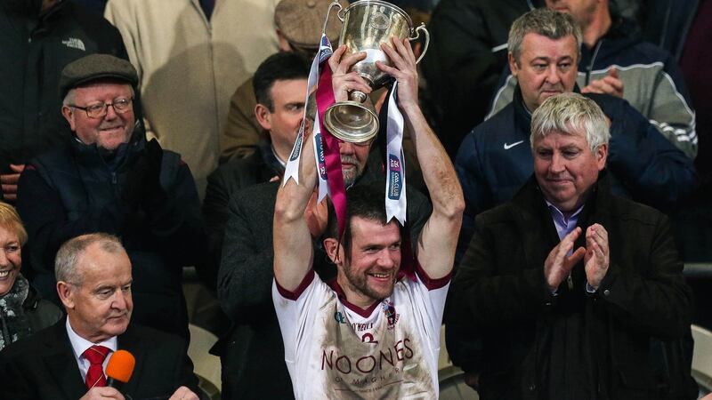 Francis McEldowney lifts the  cup after Slaughtneil’s win over Kilcoo in the Ulster senior club football final. Photograph: Presseye/Inpho
