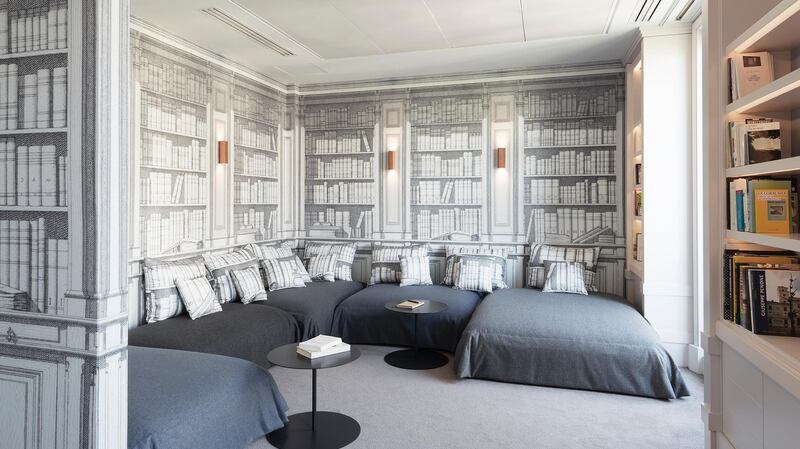 A book-inspired library that is almost devoid of books but features an X-ray version of book wallpaper.