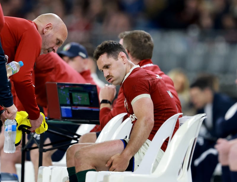 Tomos Williams leaves the pitch injured. Photograph: Dan Sheridan/Inpho