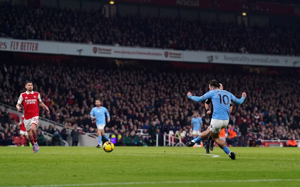 Jack Grealish scores Manchester City's second goal of the game during the Premier League match against Arsenal at the Emirates Stadium. Photograph: Adam Davy/PA Wire