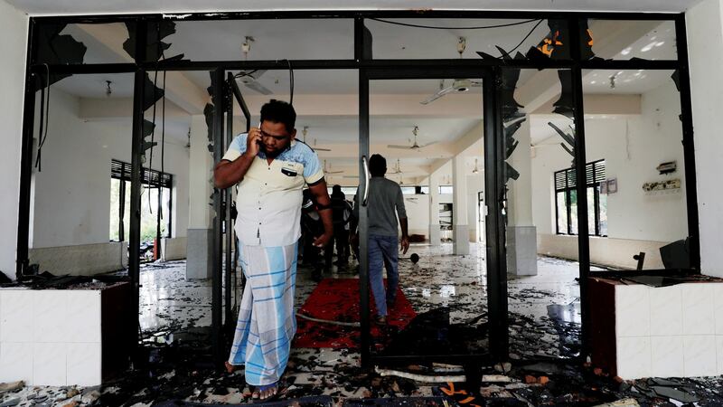 A Muslim man  inside the Abbraar Masjid mosque after a mob attack in Kiniyama, Sri Lanka. Photograph:  Dinuka Liyanawatte/Reuters