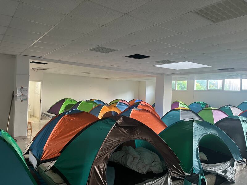 Rows and rows of tents set up for homeless asylum seekers by Utopia 56 in a previously vacant Paris building. Photograph: Jack Power